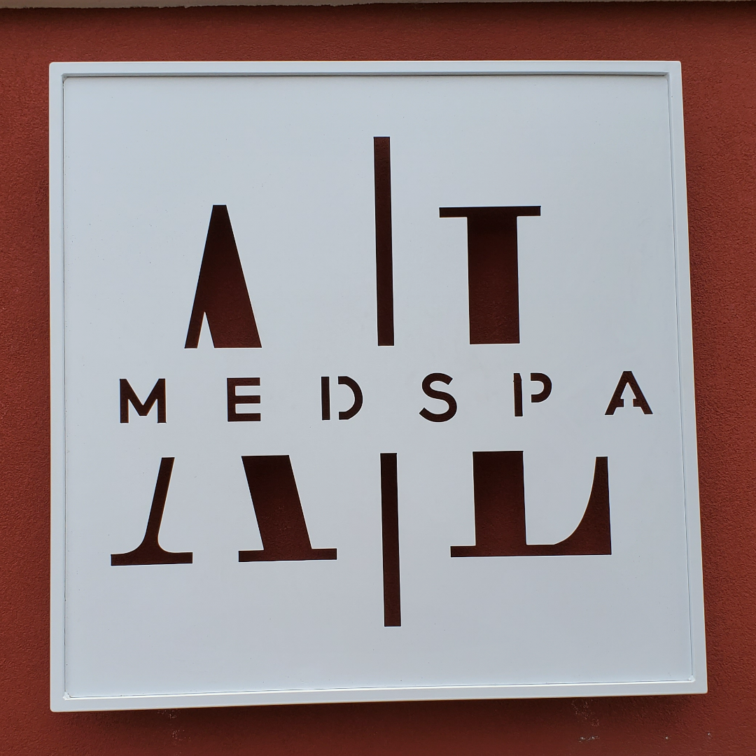 logo on a building sign with 'MED SPA' in artistic design