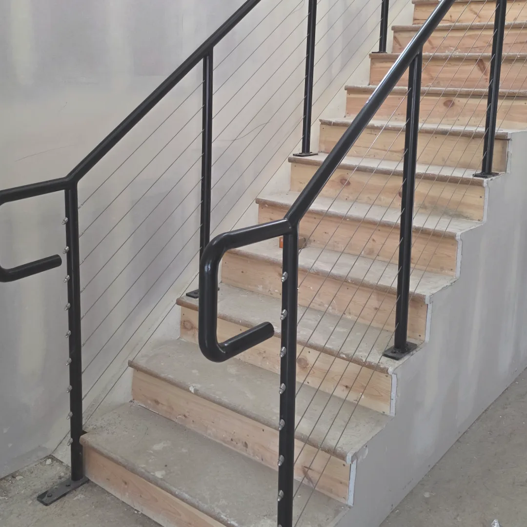 Stair railing with cable infill